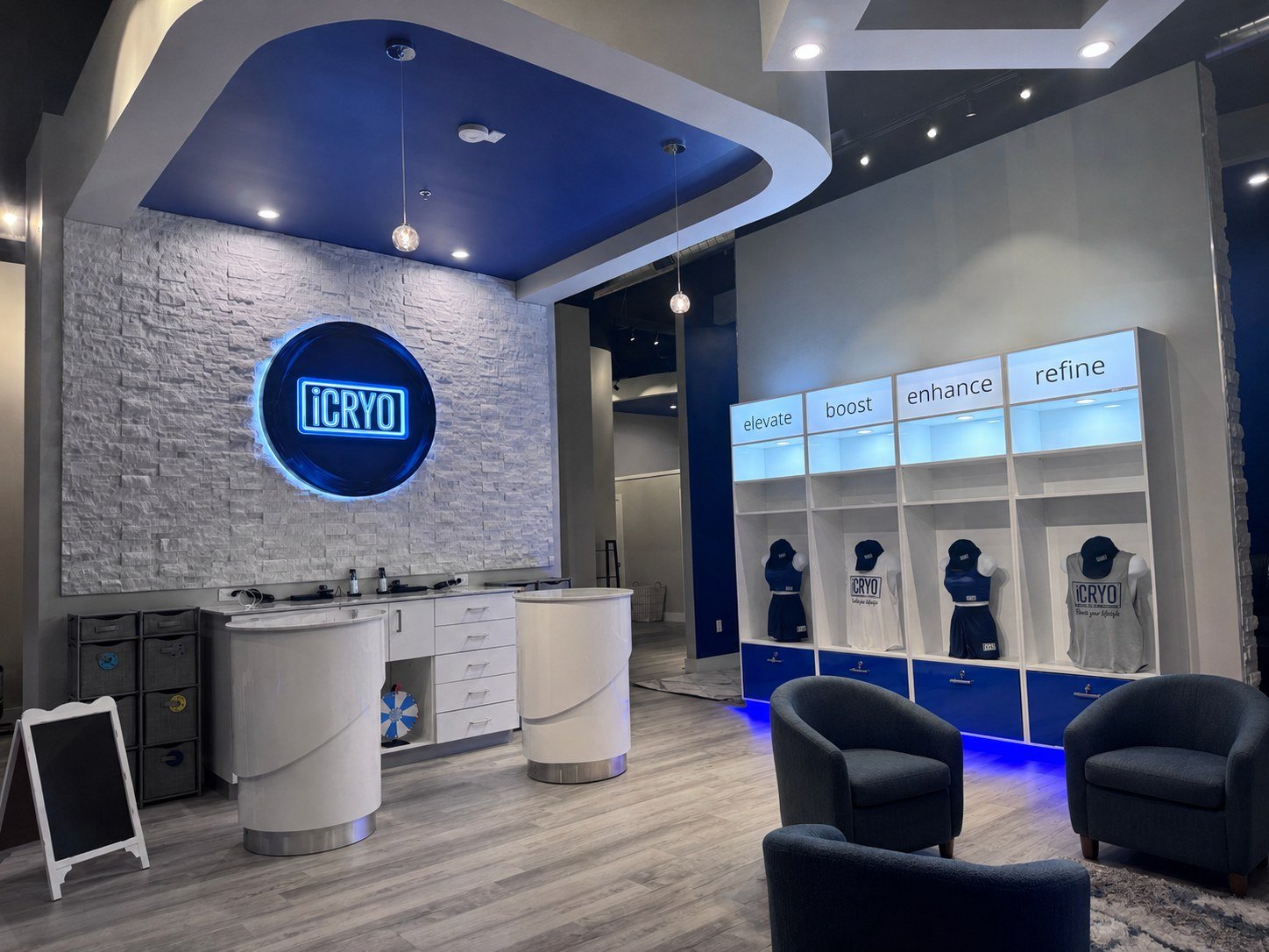 Finished commercial wellness studio interior — stacked-stone feature wall and branded retail fixtures