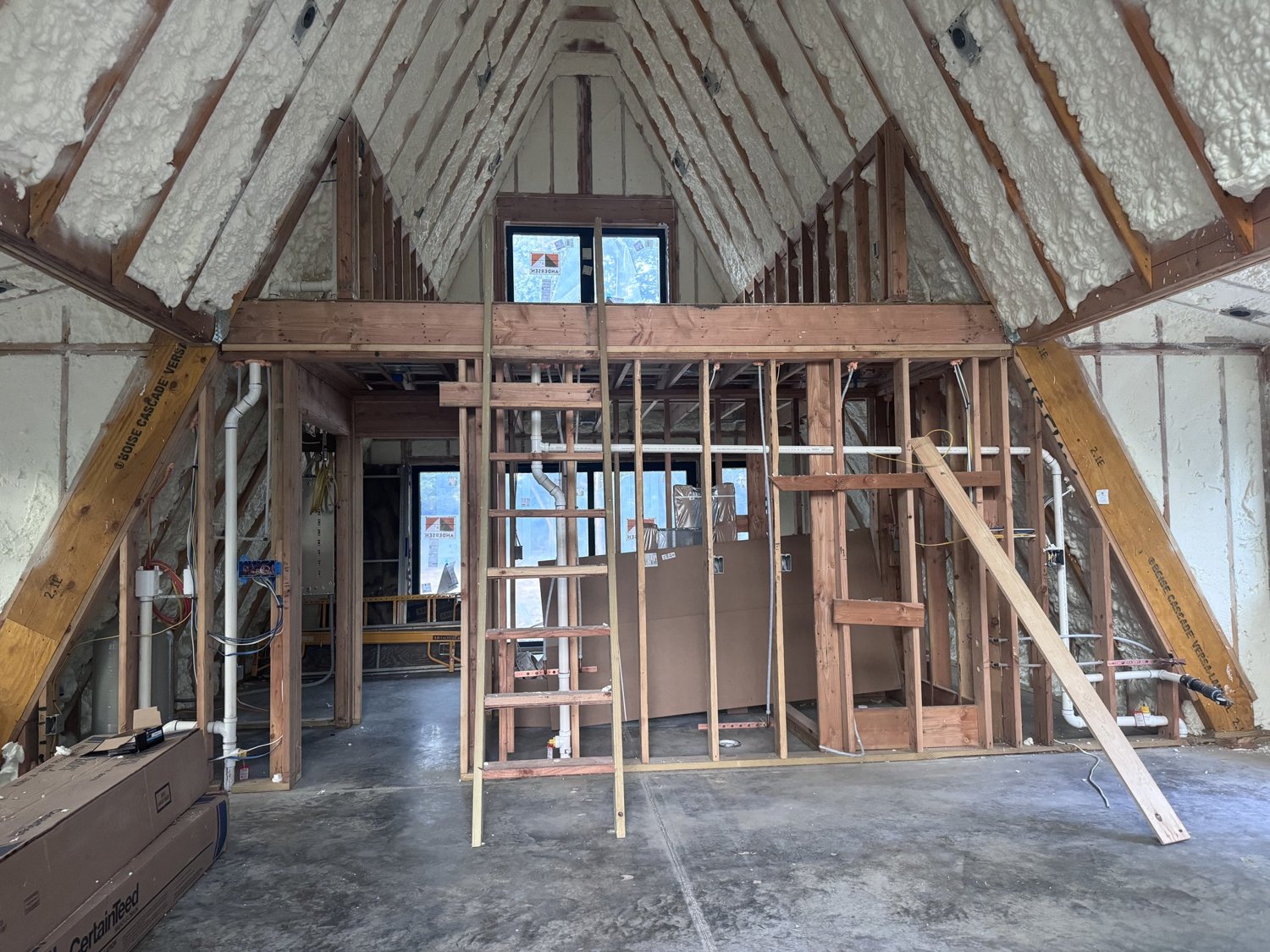 A-frame home under construction — interior framing exposed