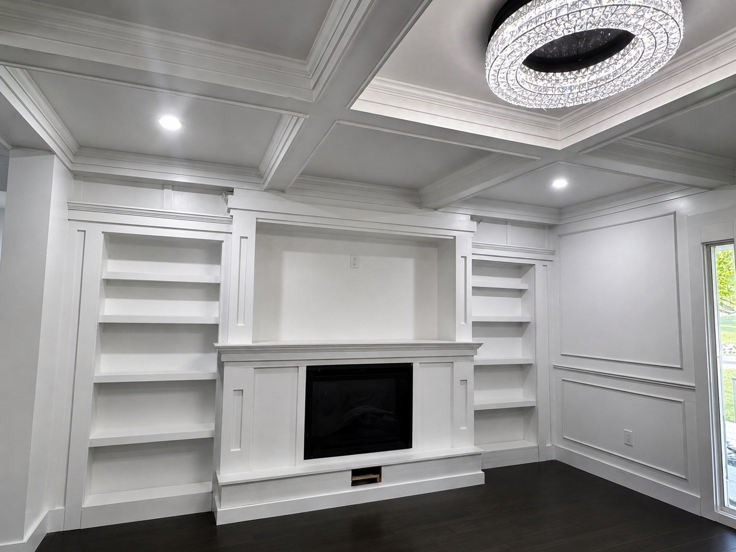 Finished living space — custom coffered ceiling and built-in millwork